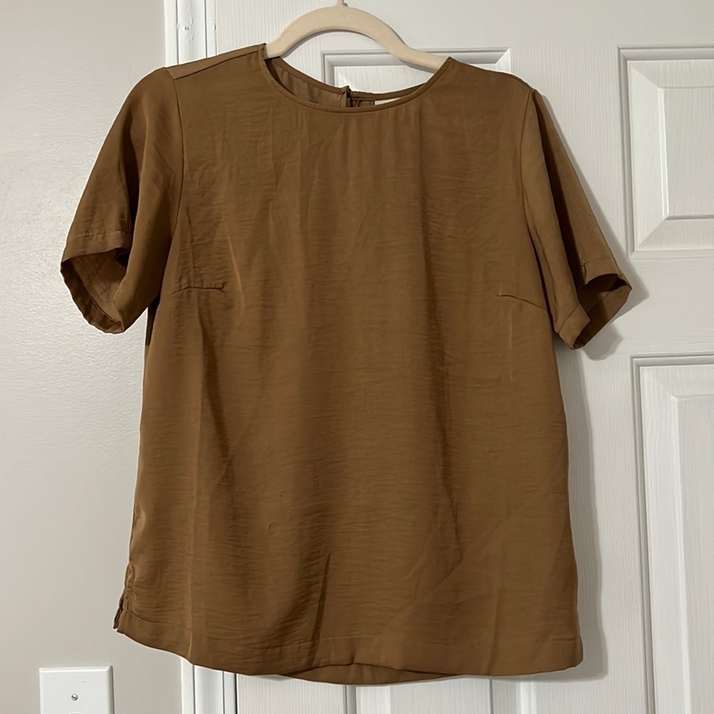Gold blouse.